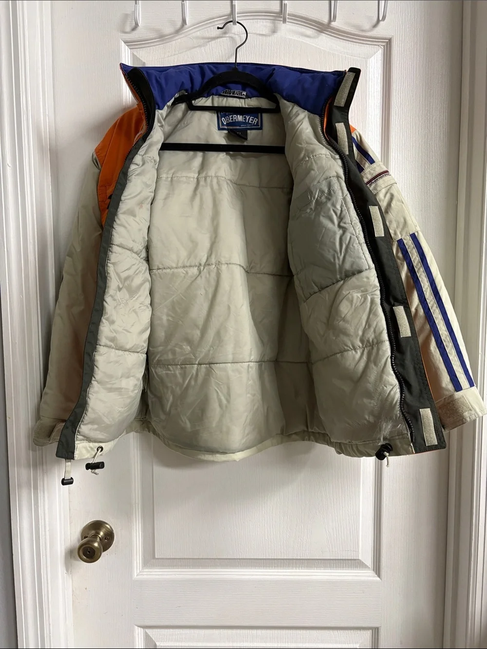 Obermeyer Orange and Cream Performance Jacket with Blue Trim